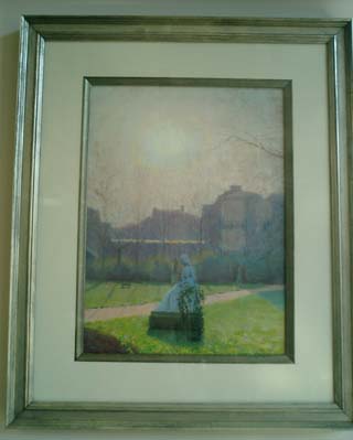 Backlit statue in a courtyard