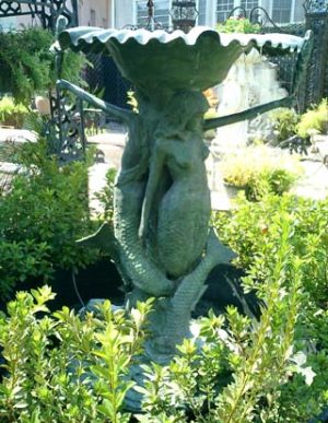 Magnificent bronze mermaid duo fountain with a scalloped bowl
