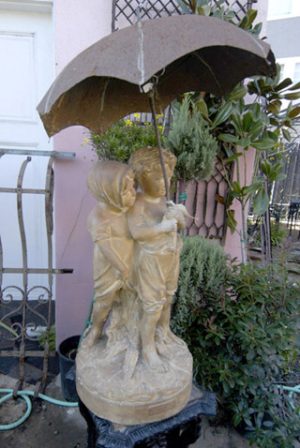 Girl and Boy Under Umbrella