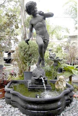 Classic Pan with flute standing on a shell fountain