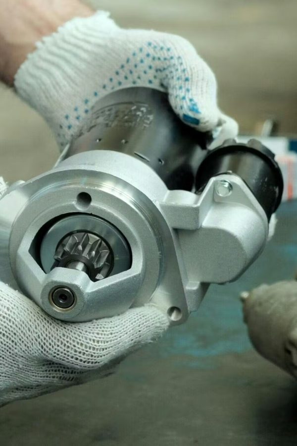https://rhinowebllc.com/mpaks-solutions/wp-content/uploads/2024/12/Mechanic_repairing_starter_motor-edited-600x900.jpg