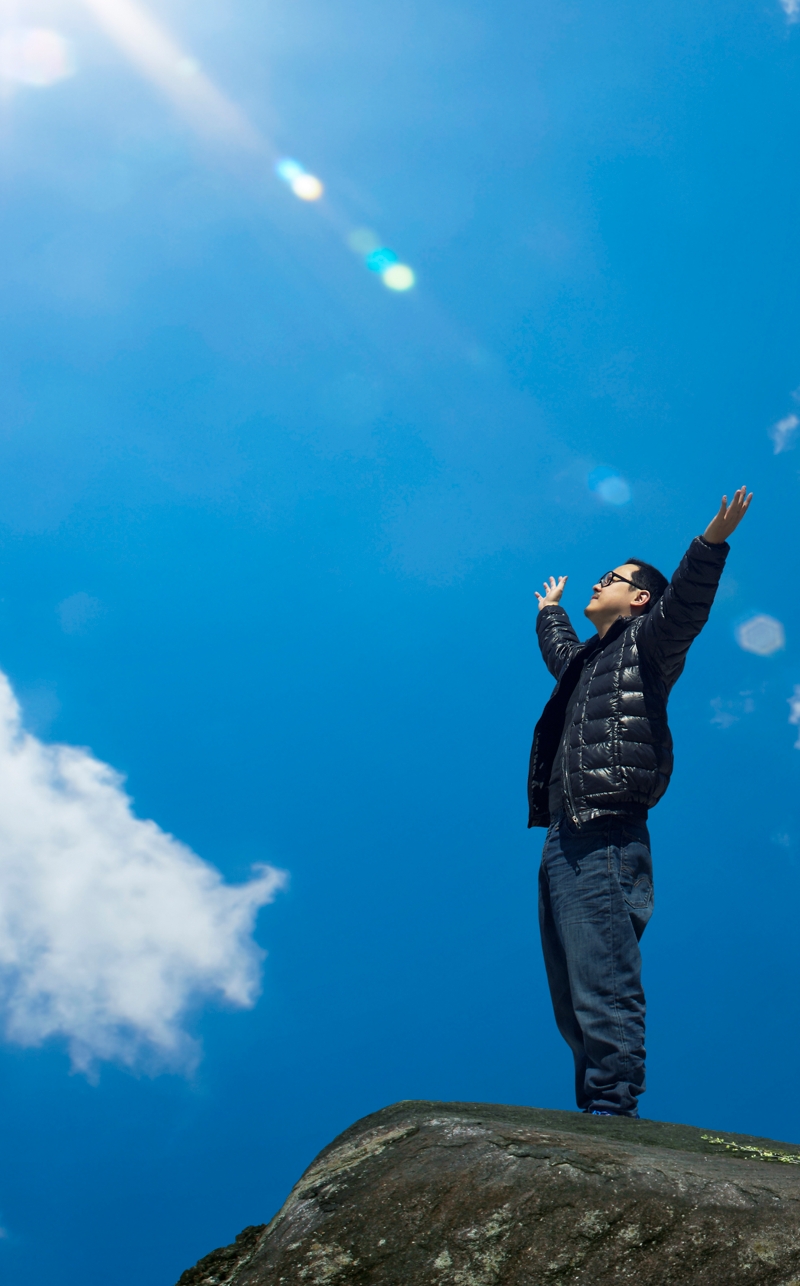 man with hands raised in the morning concept for religion, worship, prayer and praise