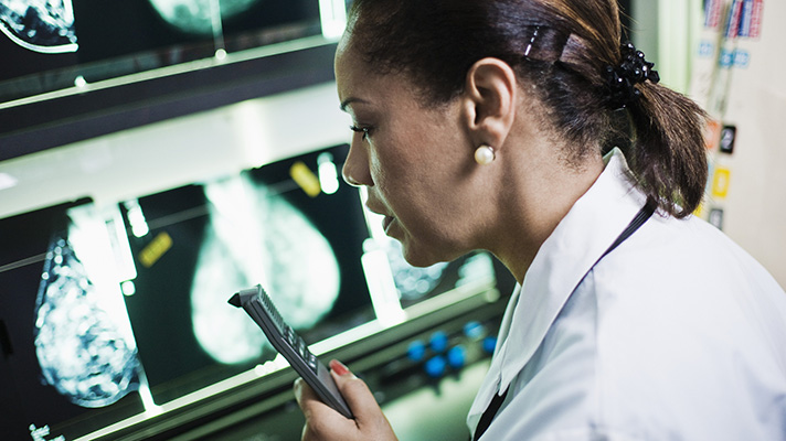 Medical Researcher Using Dictaphone --- Image by � Tim Pannell/Corbis